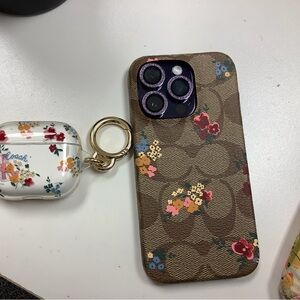Coach signature floral print iPhone 14 Pro and AirPods 3 case